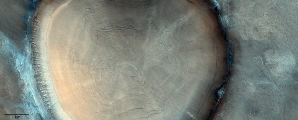 This stupendous crater on Mars looks eerily like a tree stump