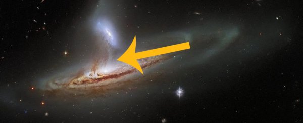 Sublime new Hubble image reveals a thrilling exchange between two galaxies