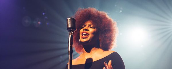 Neuroscientists Find Part of The Brain That Responds Specifically to Singing  WomanWithAfroAndRedLipsSingingOnAStage_600