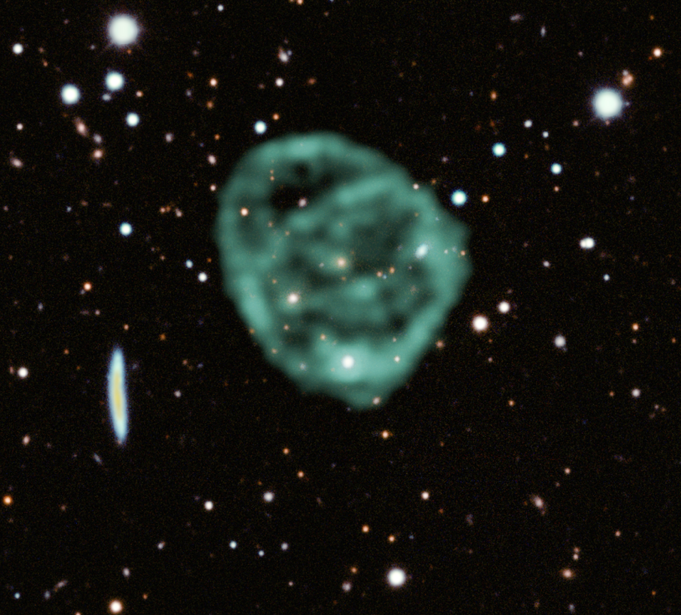 Fuzzy green conjoined bubbles hanging in the star studded darkness of space.