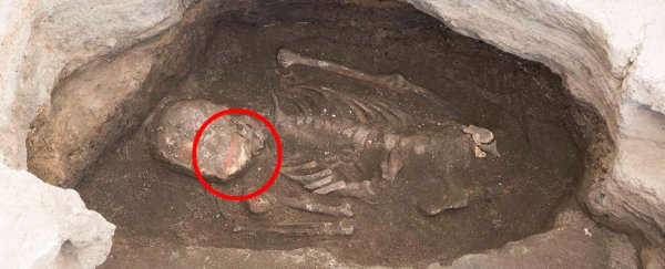 People in one of world's oldest cities colored the bones of their dead