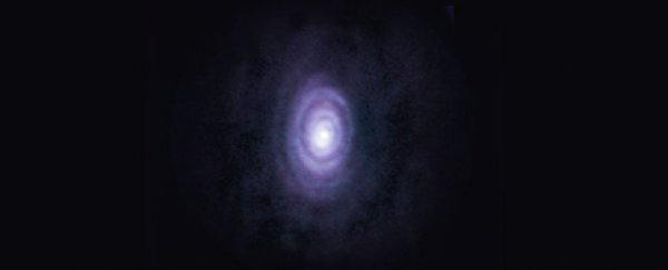 This star is expelling six strange rings of cosmic 'smoke' as it dies