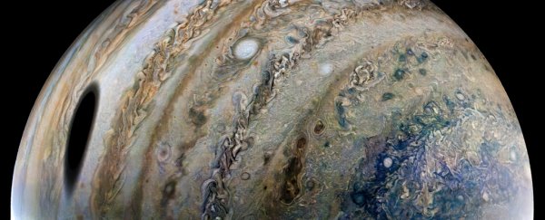 The Juno spacecraft caught Ganymede casting a stunning shadow on Jupiter