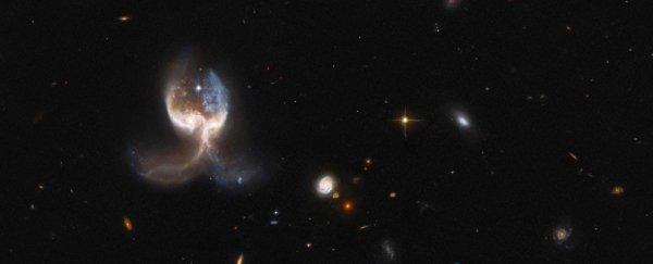 This terrifying space angel is actually a merger of two colossal cosmic objects