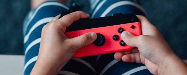 kid with video game controller