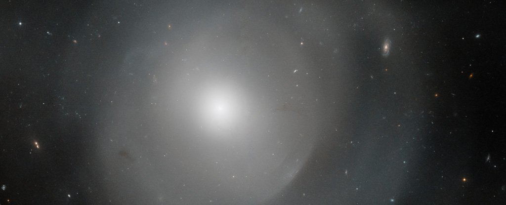 Hubble Peers Through The Mysterious Shells of This Gigantic Elliptical Galaxy