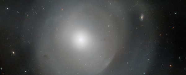 Hubble peers through the mysterious shells of this gigantic elliptical galaxy