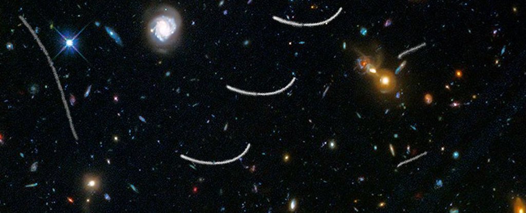 Asteroids streak across Hubble's field of view. 