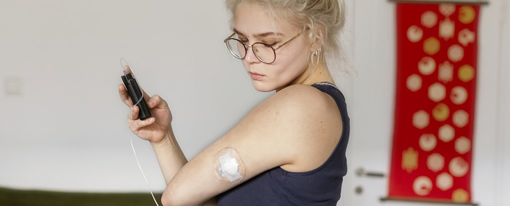 A person using an insulin pump. 