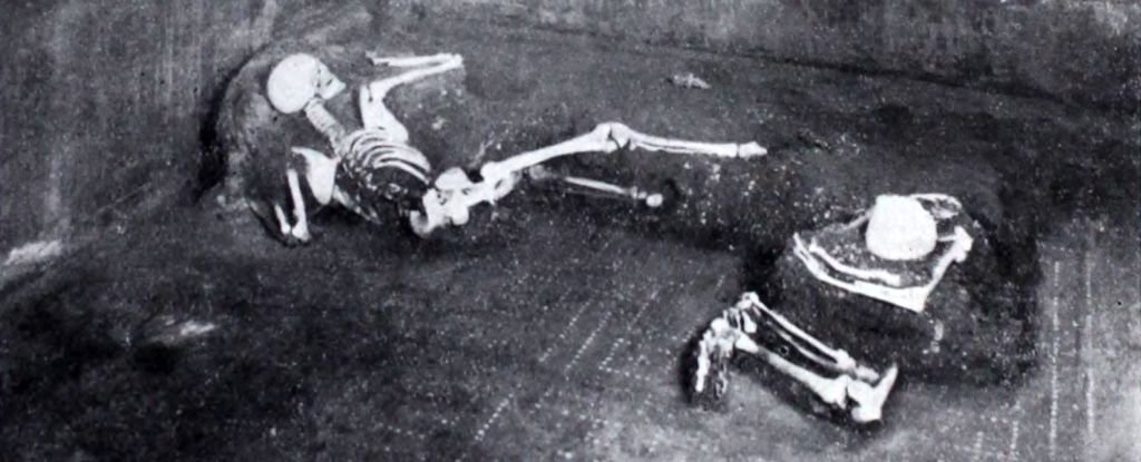 The two individuals, laying as they died. 