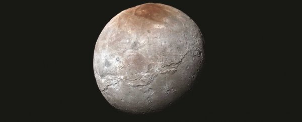 Pluto's moon has a mysterious red north pole, and we may finally know why