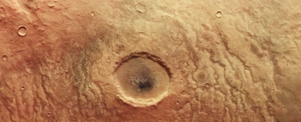 An unnamed crater in the Aonia Terra on Mars, in true color. 