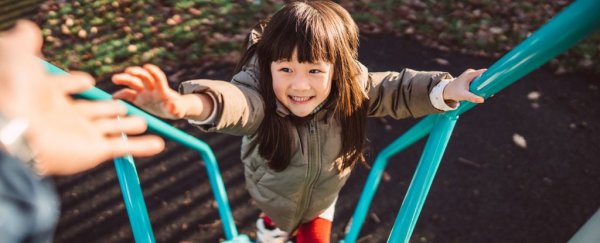 A child climbing up a ladder