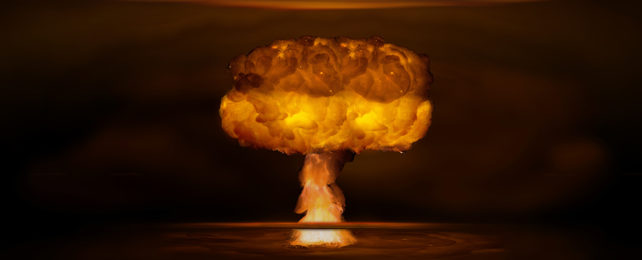 Orange nuclear blast on black background