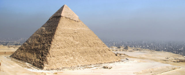 Pyramids of Giza with the city of Cairo in background