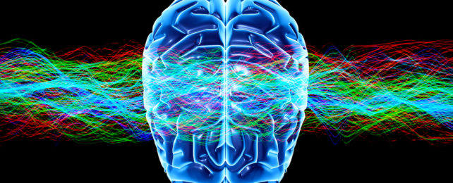 3D model of human brain behind multicolored wavy lines.