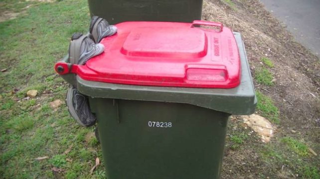 Bin sealed shut with shoes