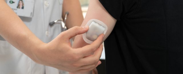 Device Being Put On Patient's Arm