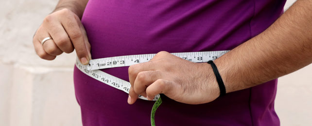 Measuring tape around a waist