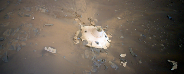 The backshell of the Perseverance Mars rover lies smashed on the surface of the moon.