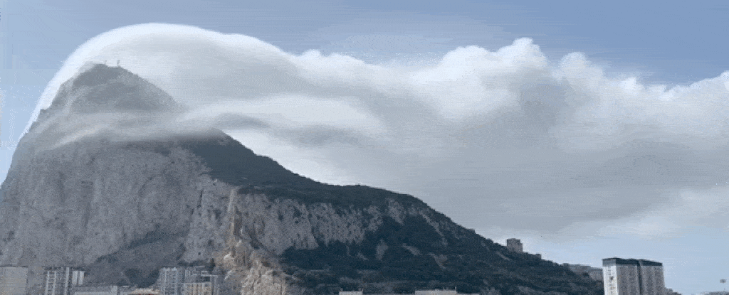 Extraordinary Cloud Caught Waterfalling Over The Rock of Gibraltar