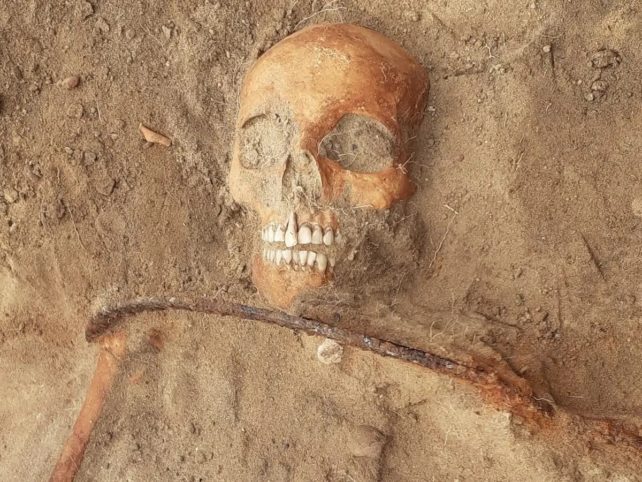 Skeleton Buried In Poland With Sickle Over Neck
