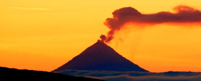 Volcano Against Bright Orange Sky