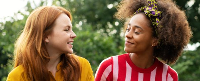 Two Women Talking Together Happily