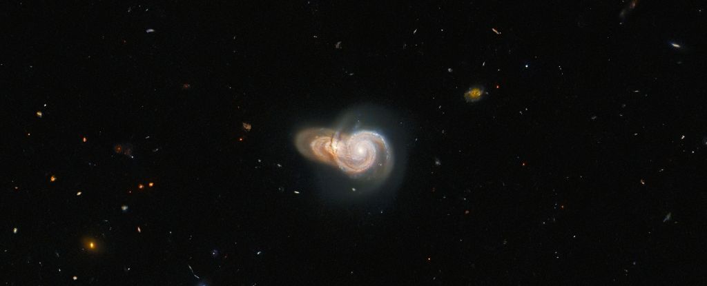 Hubble captura 2 galaxias superpuestas para formar un impresionante ‘caracol’ interestelar: ScienceAlert