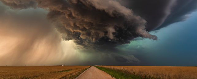 Storm clouds over a country road