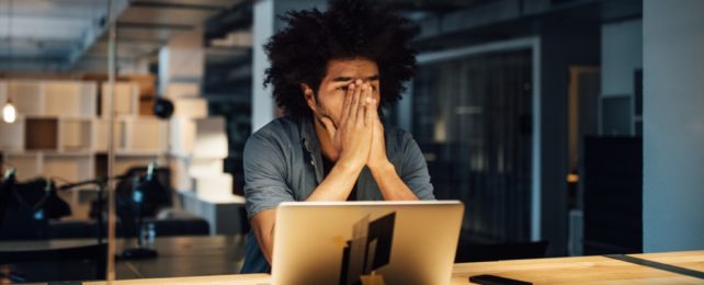 Tired Worker In Office At Night