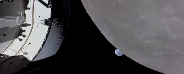earth just behind the lunar horizon with orion's engines in the foreground