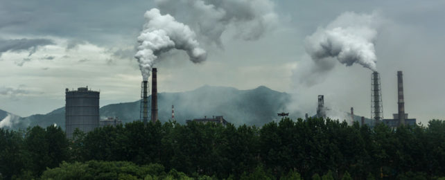 A coal power plant emitting smoke..