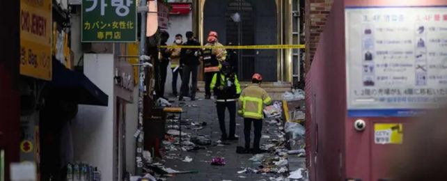 Itaewon alley in Seoul, with emergency workers