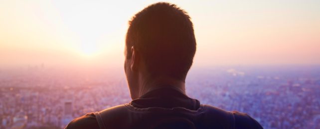 Man Looks Over City Skyline