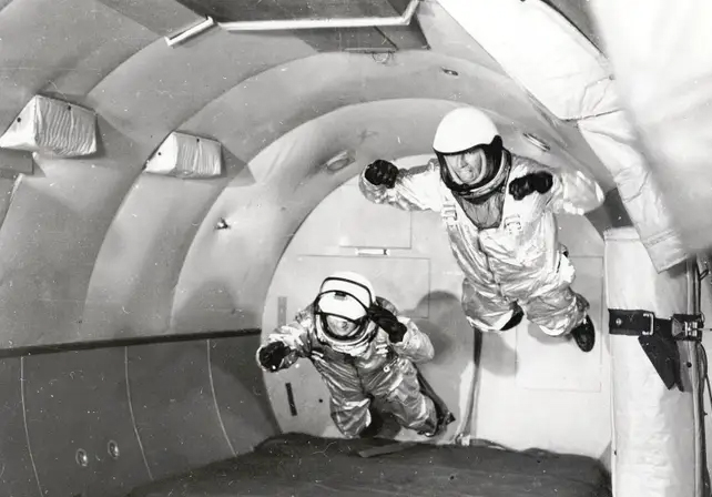 archival footage of mercury program astronauts in freefall
