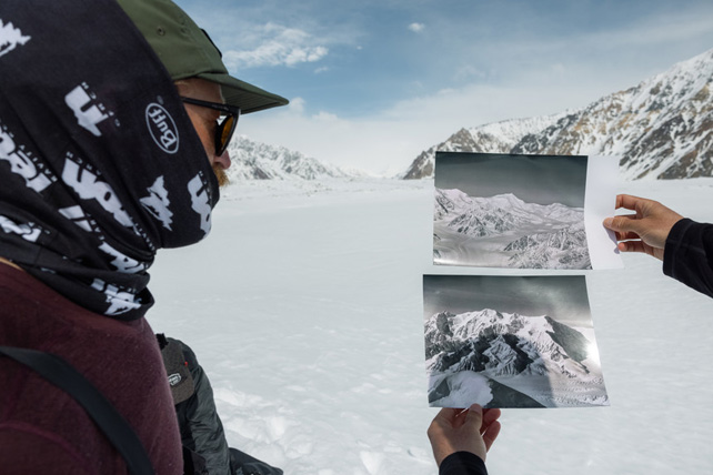 People compare photos of a glacial landscape with the current view of the landscape.