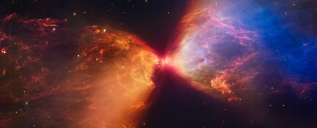 An hourglass-shaped ejection of red, orange, and blue-colored matter in space.