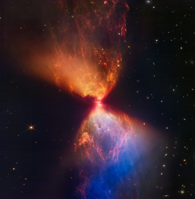 An hourglass-shaped ejection of red, orange, and blue-colored matter in space.