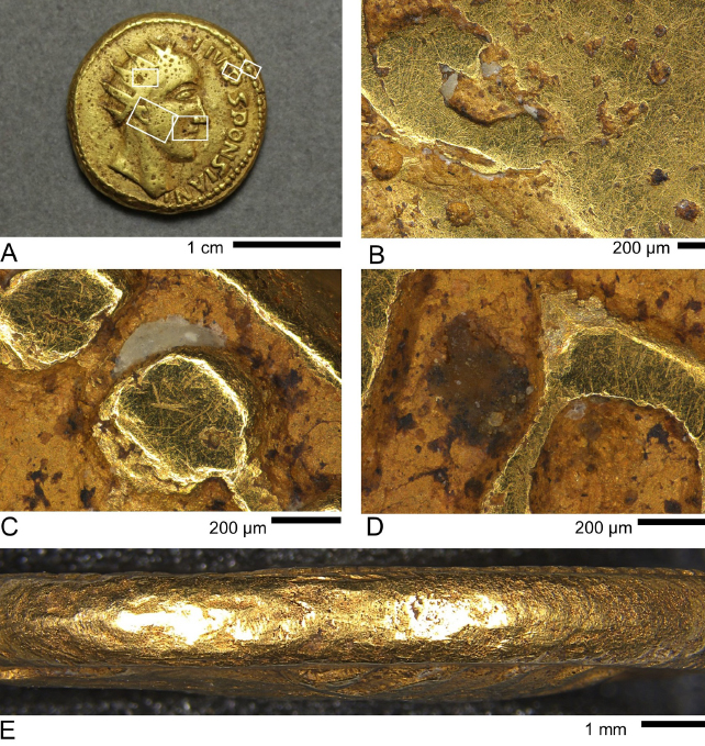 Scratches seen on the surface of Roman coins up close