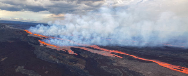 Smoke and lava erupting from a volcano.