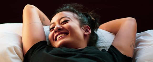 Woman Smiling In Bed