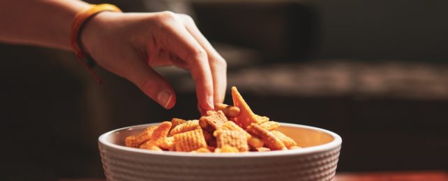 Hand Reaches For Chips In Bowl
