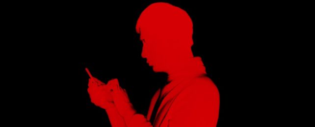 Red Silhouette On Black Of Man On Phone