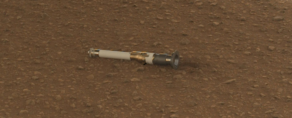 A sample depot cylinder on the Martian surface.