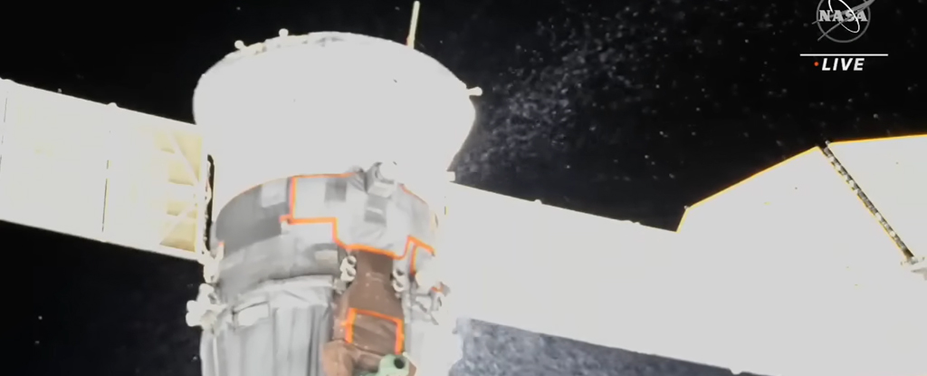 Soyuz module leaking a stream of particles into space
