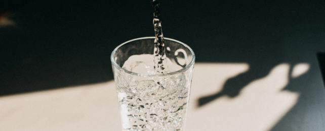 water glass being filled