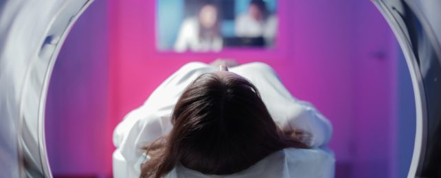 Young Woman In MRI Machine