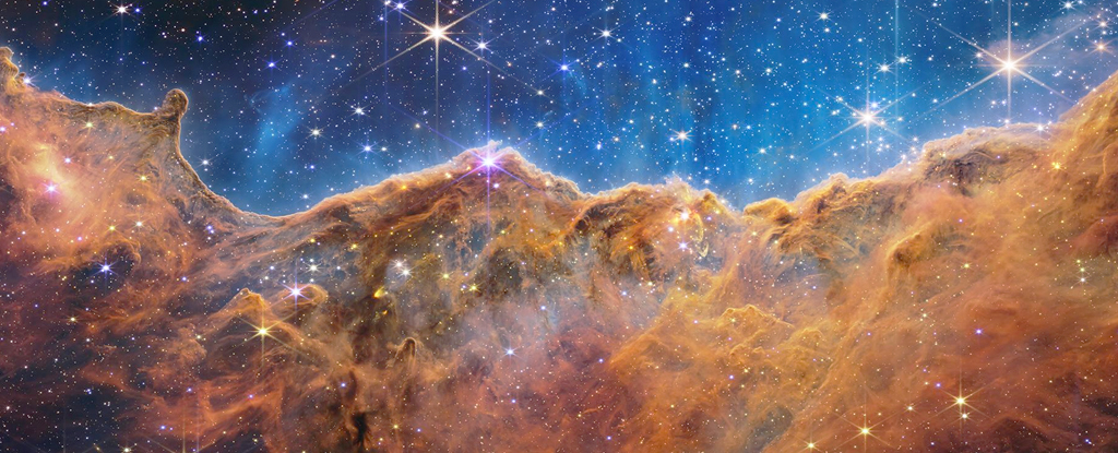 JWST Has Spotted Never-Before-Seen Star Birth in The Carina Nebula, And It's Glo..