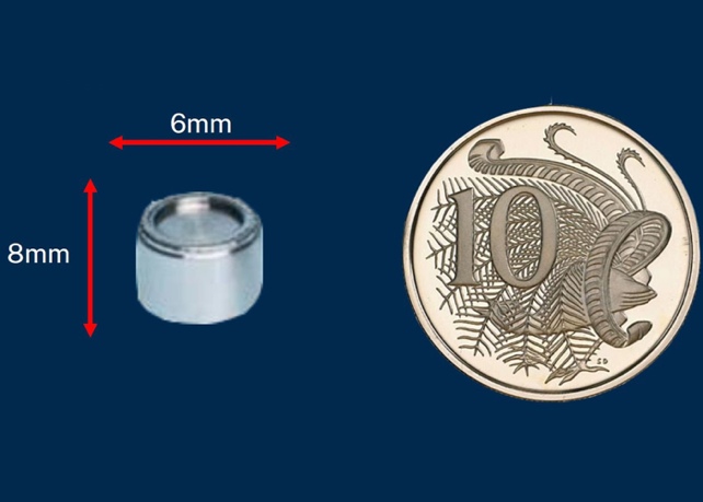 Caesium Capsule Beside Coin